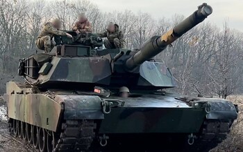 The Abrams tank is seen in a green camouflage at an unidentified location in Ukraine